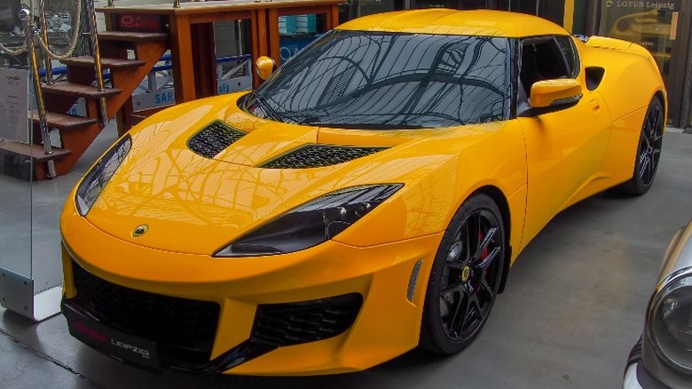 Yellow Lotus Evora GT at a car show