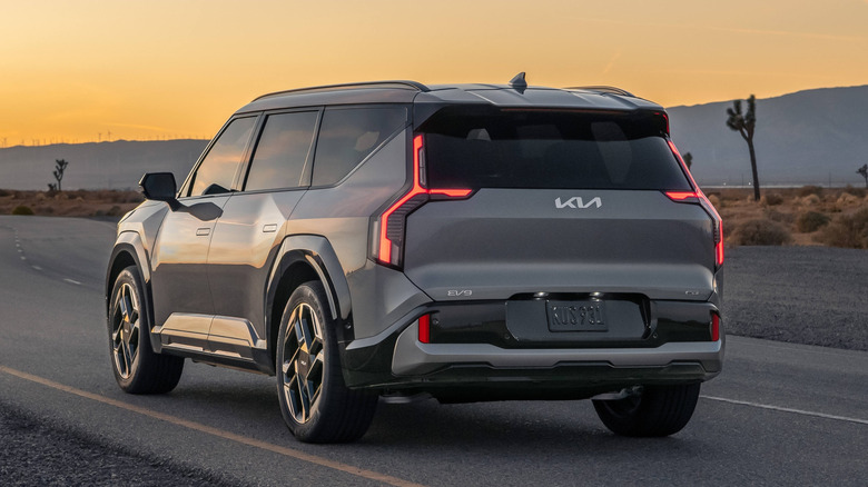 Rear view of 2026 Kia EV9 GT on road in desert