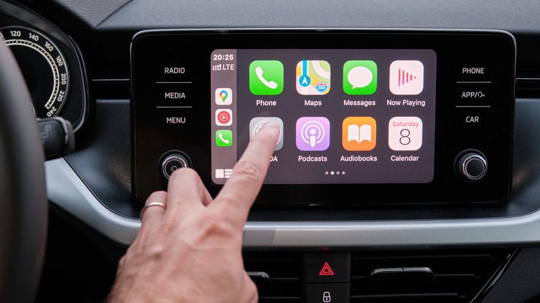 person using apple carplay display