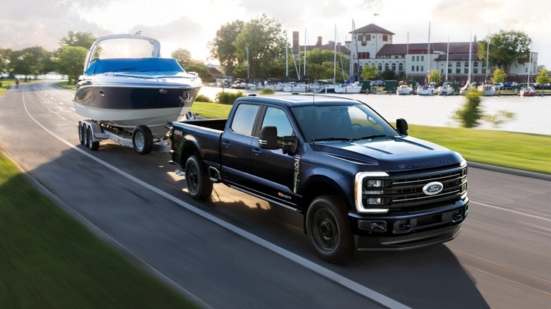 Ford F-350 Platinum towing boat with marina in the background