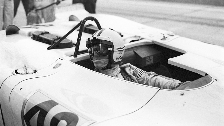 Steve McQueen in cockpit racecar