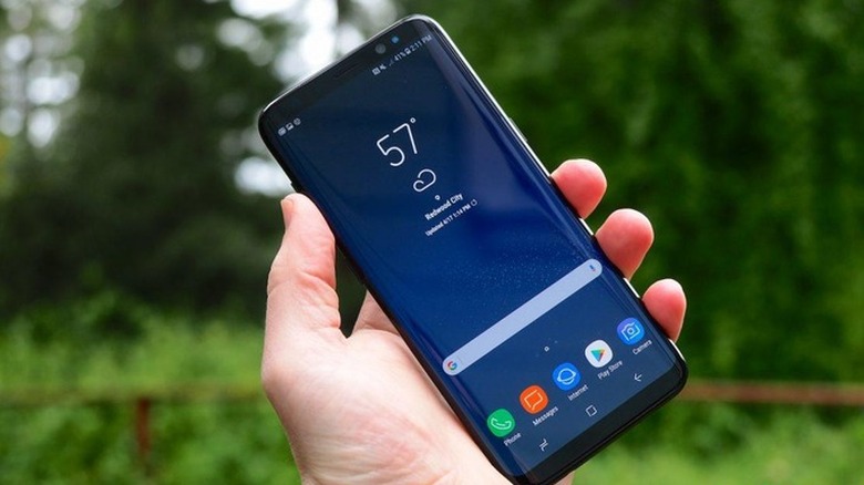 Samsung Galaxy S8 in hand outdoors