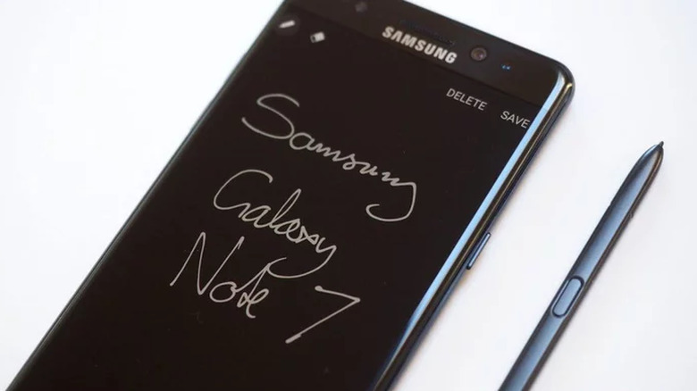 Samsung Galaxy Note 7 with S-Pen and text written on screen