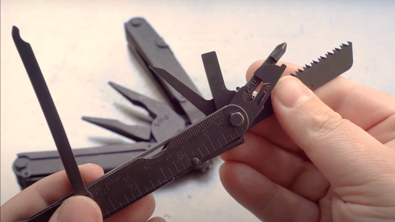 Person holding up multi-tool