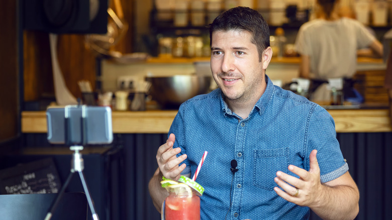 Man recording video with wireless mic