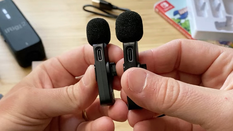 Holding two Maybesta microphones