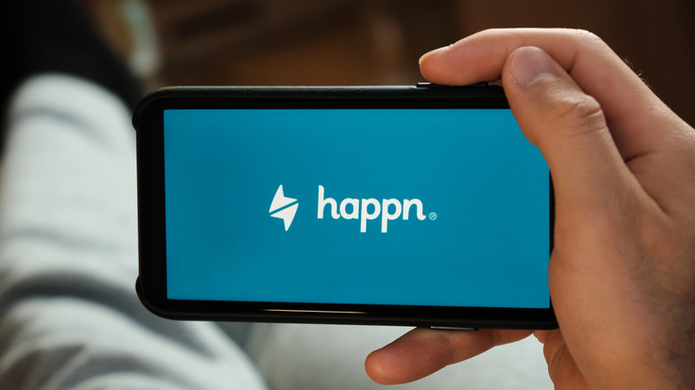 Happn logo on phone screen