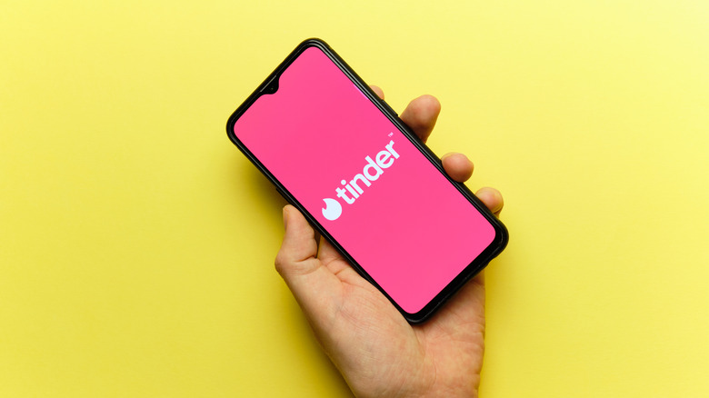 Tinder logo on phone screen