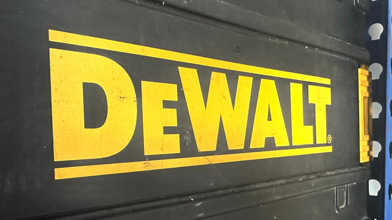 The DeWalt logo on the side of a black container.