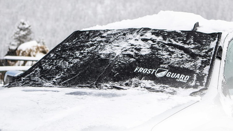 snow-covered FrostGuard Plus on a car