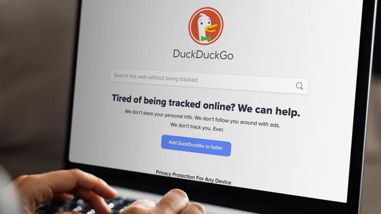 person using DuckDuckGo browser on a laptop