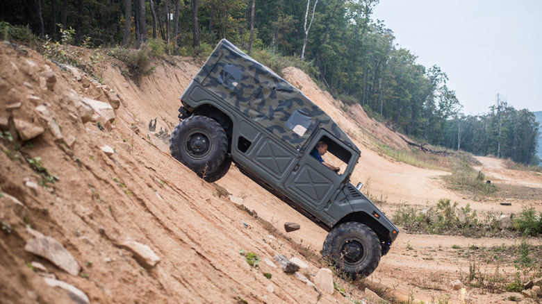 Toyota Mega Cruiser driving off-road cliff