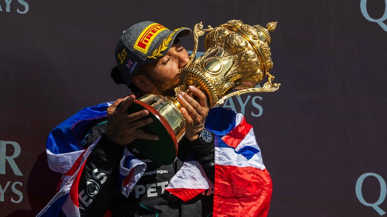 Lewis Hamilton kissing trophy