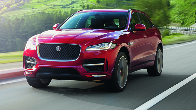 Red Jaguar F-Pace Sport driving at speed