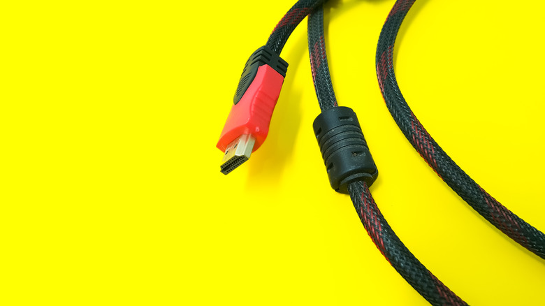 HDMI cable against a yellow background