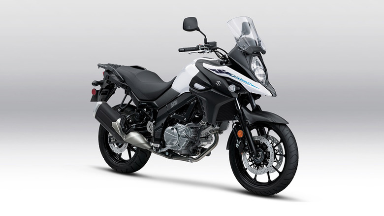 A black and white Suzuki motorcycle on a white background