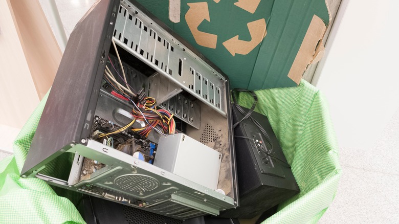 Old PC in recycling bin.