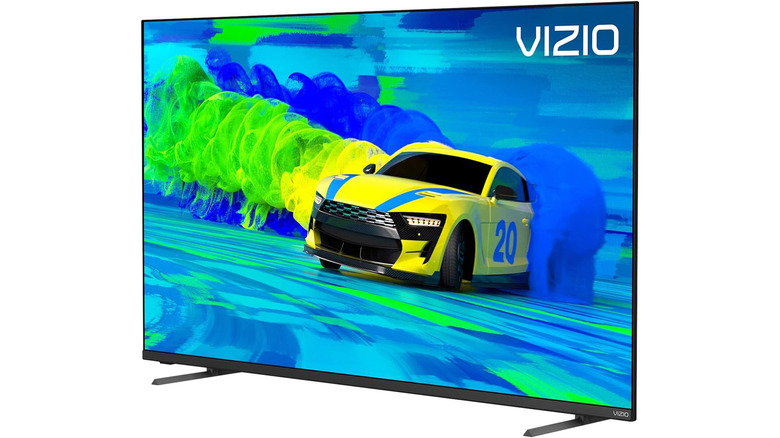 A Vizio M-series TV showing a race car and colorful smoke