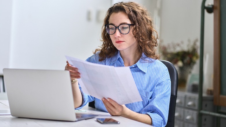 Woman holding paperwork