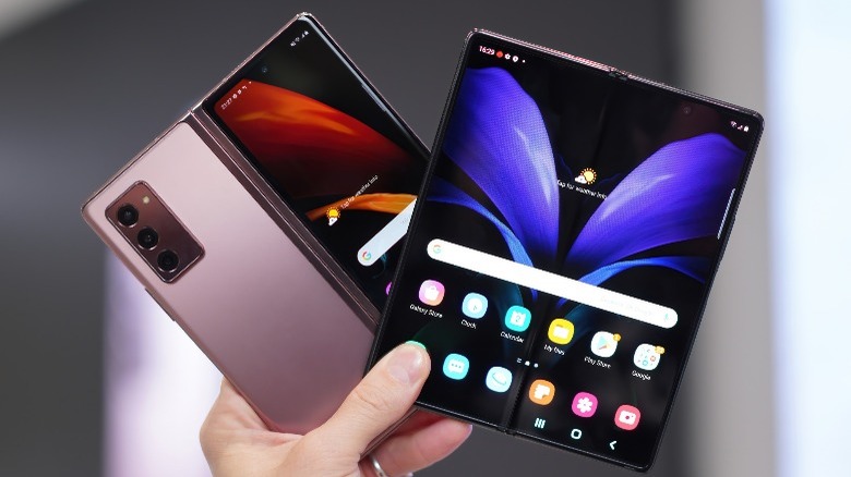 Person holding Samsung's foldable phones.