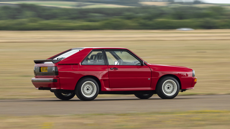 Red Auto Sport Quattro side profile driving at speed