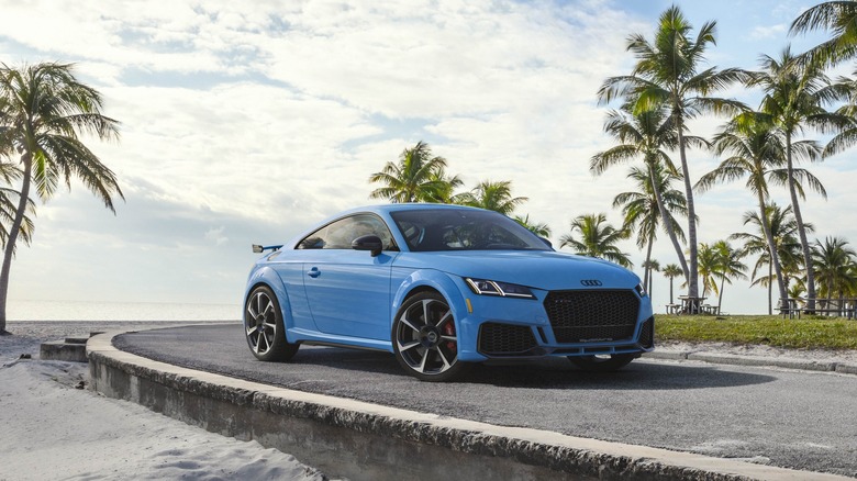 Blue Audi TT RS Heritage Edition parked near the sea