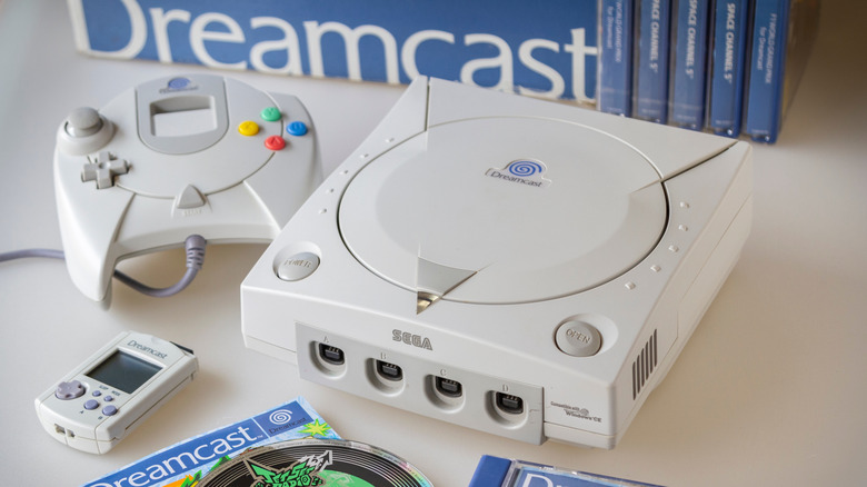 Sega Dreamcast next to a controller 