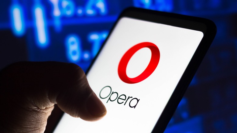 hand touching phone with opera