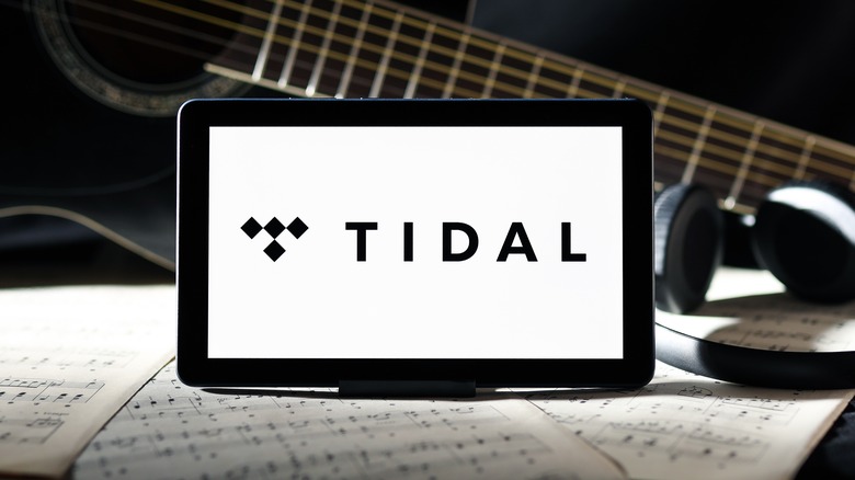 tidal logo with guitar, headphone and music sheets