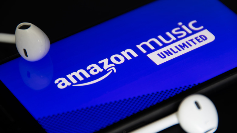 amazon music unlimited on phone with earbuds