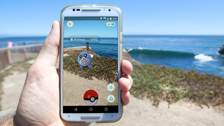 Playing Pokemon Go on beach