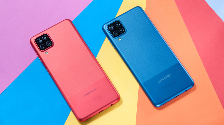 Samsung Galaxy A12 smartphone in red and blue color options.