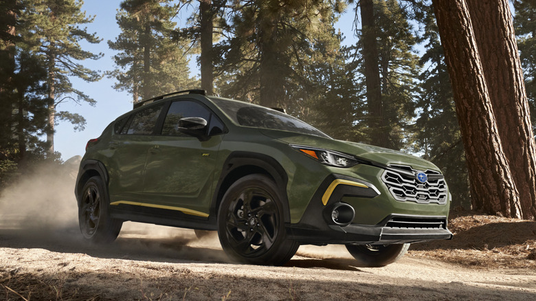 Subaru Crosstrek driving in the woods