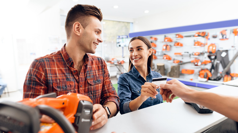 people buying tools at a hardware store