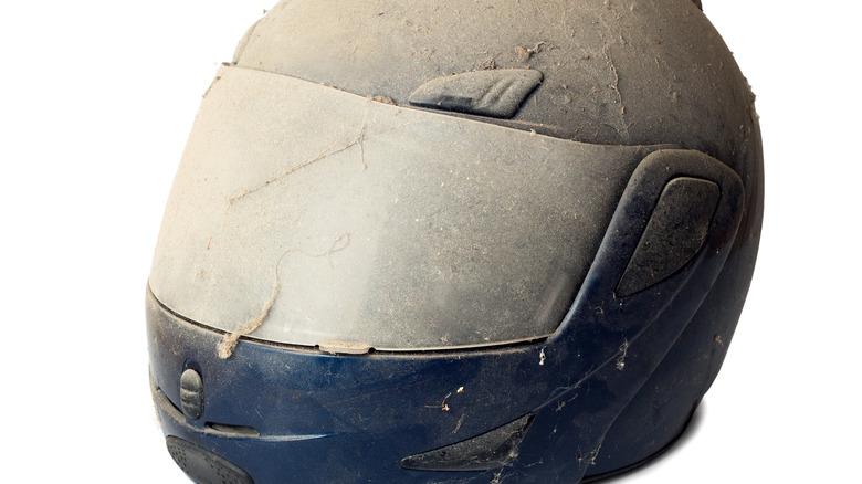 motorcycle helmet covered in dirt