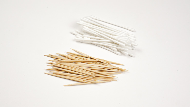 piles of toothpicks and cotton swabs