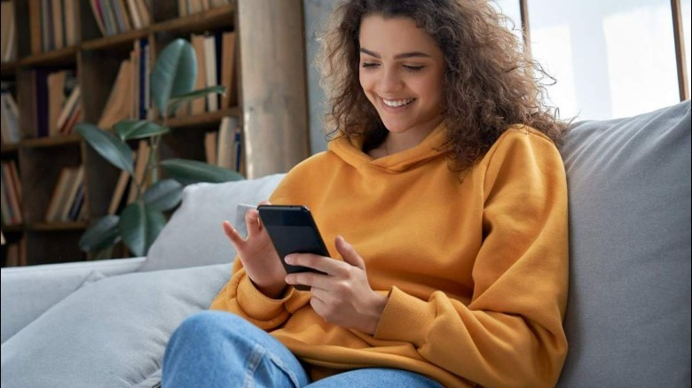 Woman playing a game on a phone