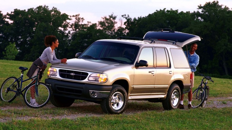 Preparing for bike ride near 2001 Ford Explorer