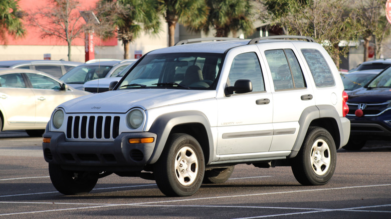 Silver 2002 Jeep Liberty parked