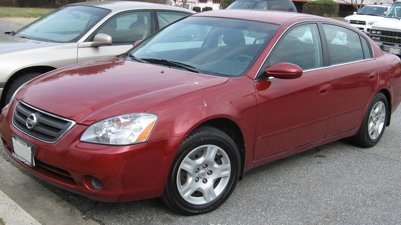 Red 2004 Nissan Altima parked 