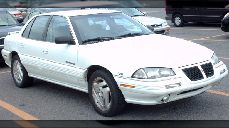 White 1992 - 1995 Pontiac Grand Am in parking lot