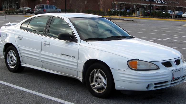 White 1999 - 2002 Pontiac Grand Am in parking lot