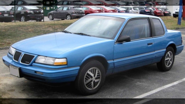 Blue 1989 - 1991 Pontiac Grand Am in parking lot