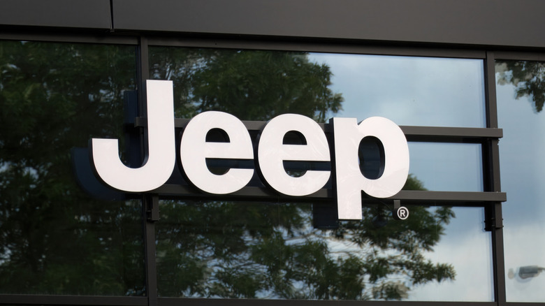 An Automotive Dealer With Jeep Lettering Across The Windows