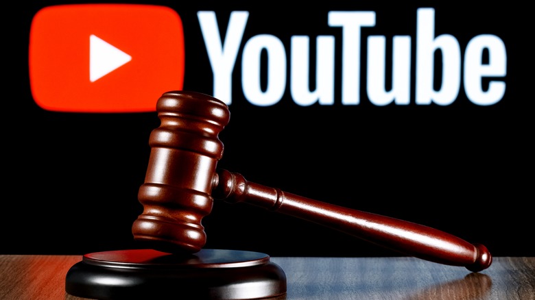 YouTube logo behind a gavel 