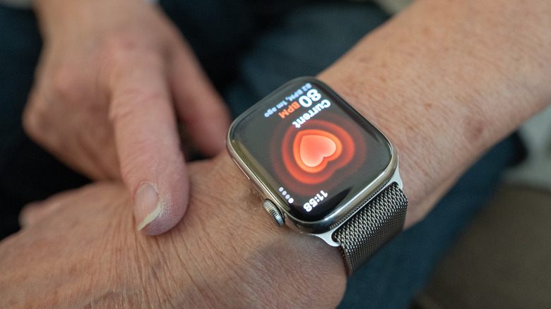 A person checking their hart rate activity on a smartwatch