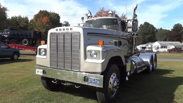 A parked 1974 Dodge Big Horn semi-truck In silver