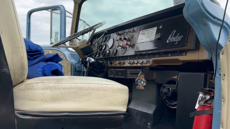 A Dodge Big Horn interior showcasing a tight space through open passenger door