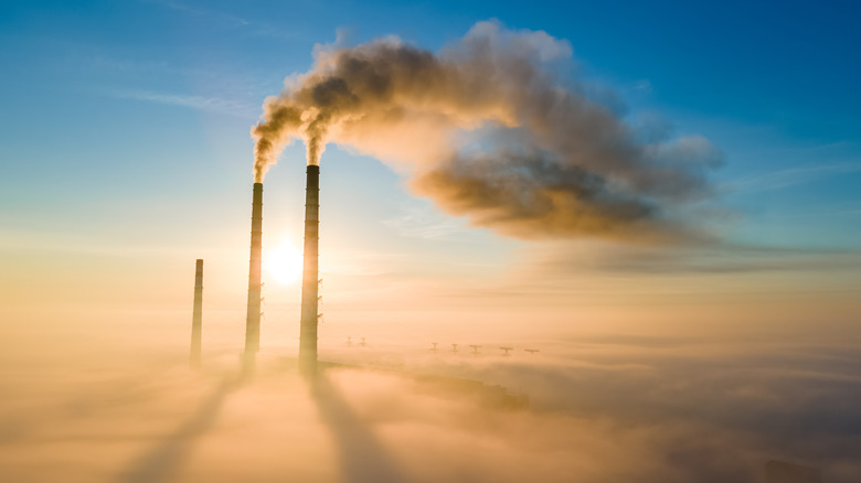 Two chimneys smoke carbon emissions