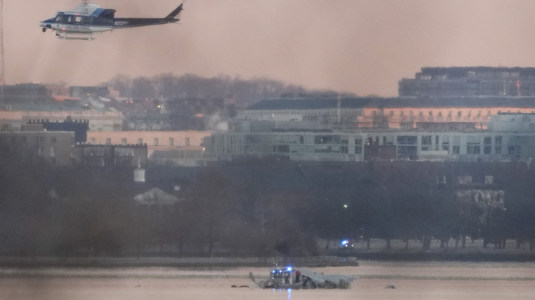 Helicopter flies near crash site of black hawk and bombardier in DC